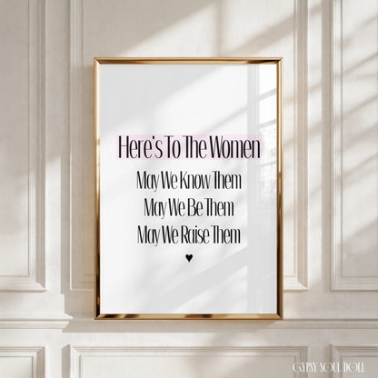 Elegant A4 typography poster print reading Here's To The Women May We Know Them May We Be Them May We Raise Them with a pink highlight strip and a black heart icon.
