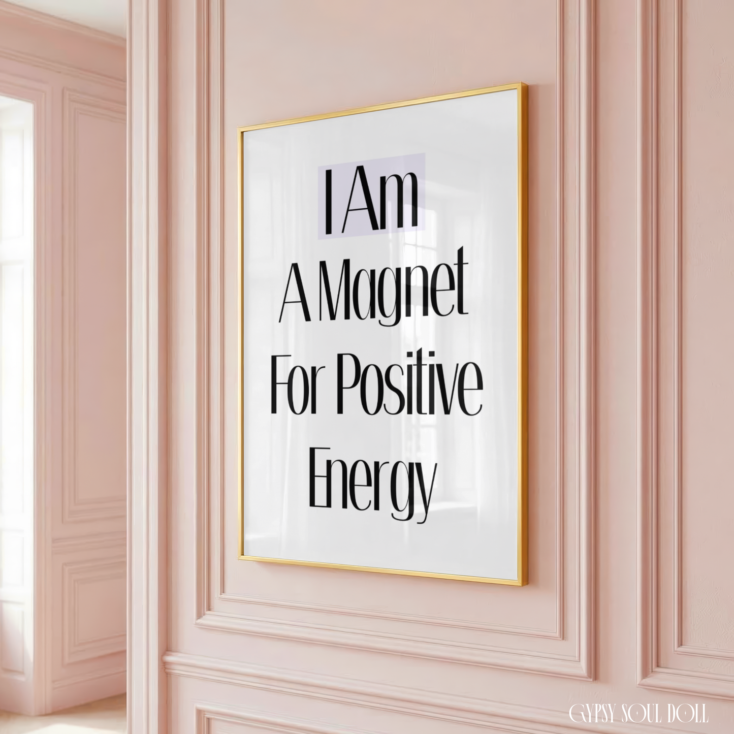 Framed poster with motivational quote on a pink wall