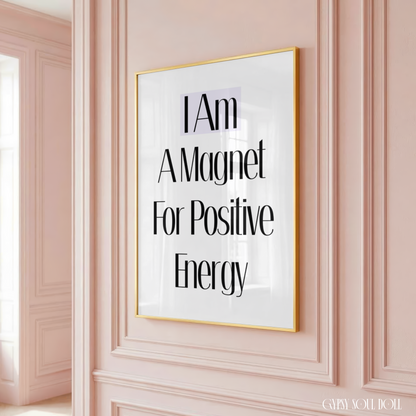 Framed poster with motivational quote on a pink wall