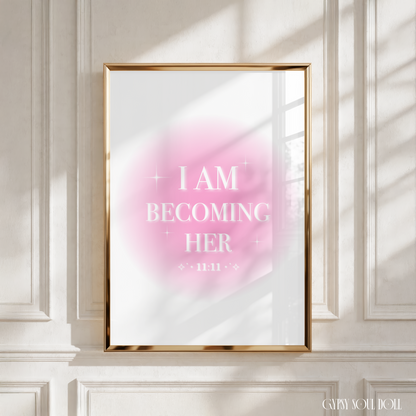 Minimalist A4 soft pink gradient aura poster for personal development displaying the text I Am Becoming Her with the 11:11 angel number reminder.