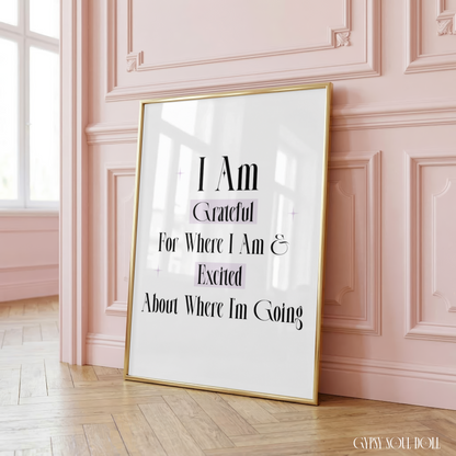 Minimalist A4 motivation office wall art print displaying the phrase I Am Grateful For Where I Am and Excited About Where I'm Going in sharp black lettering with soft purple highlight boxes and star sparkles.