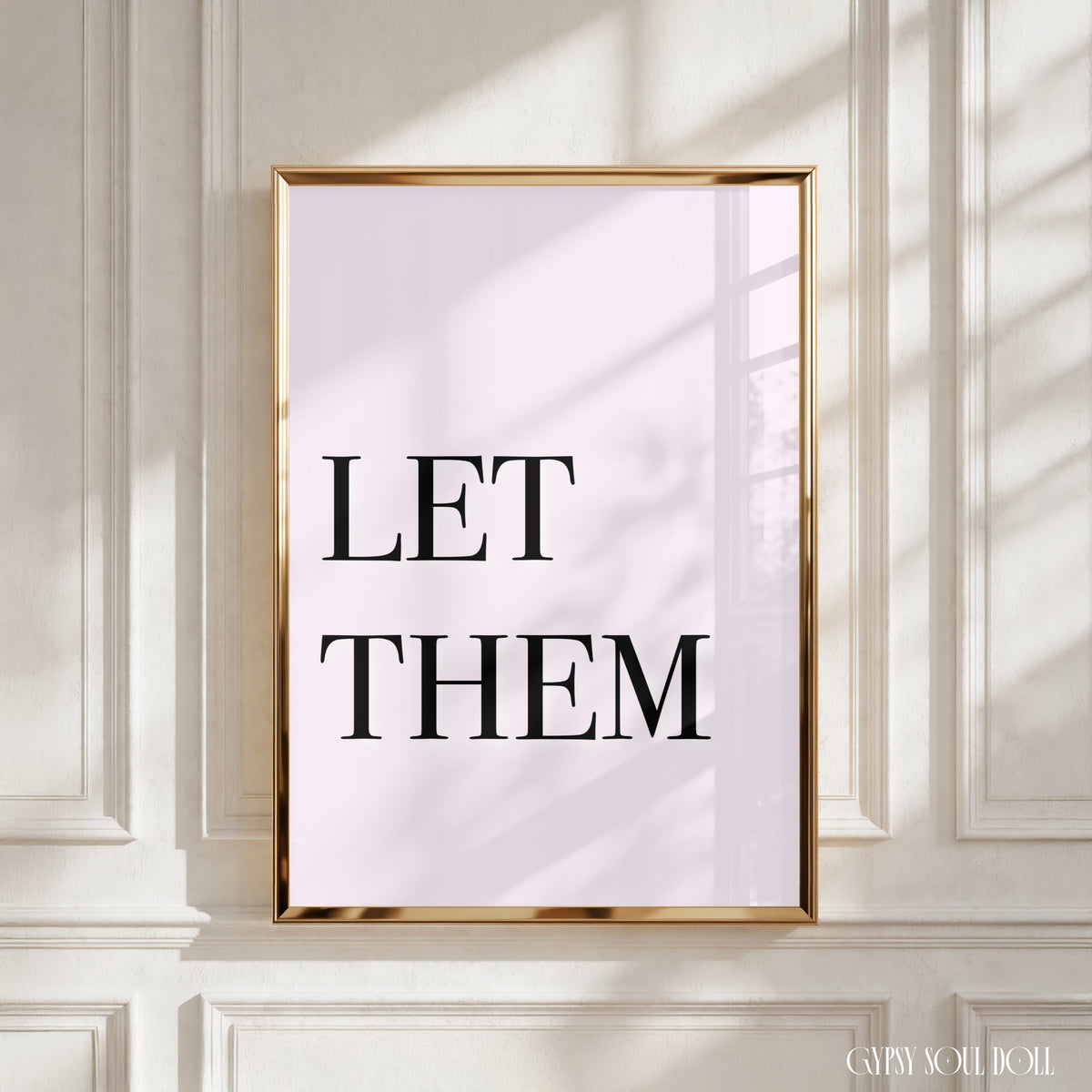 High-impact minimalist pink art print reading "Let Them" in a bold black serif font.