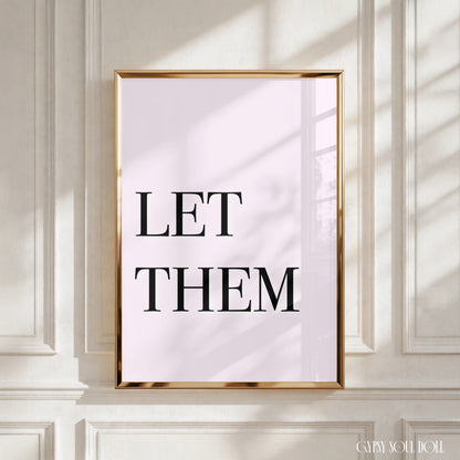 High-impact minimalist pink art print reading "Let Them" in a bold black serif font.