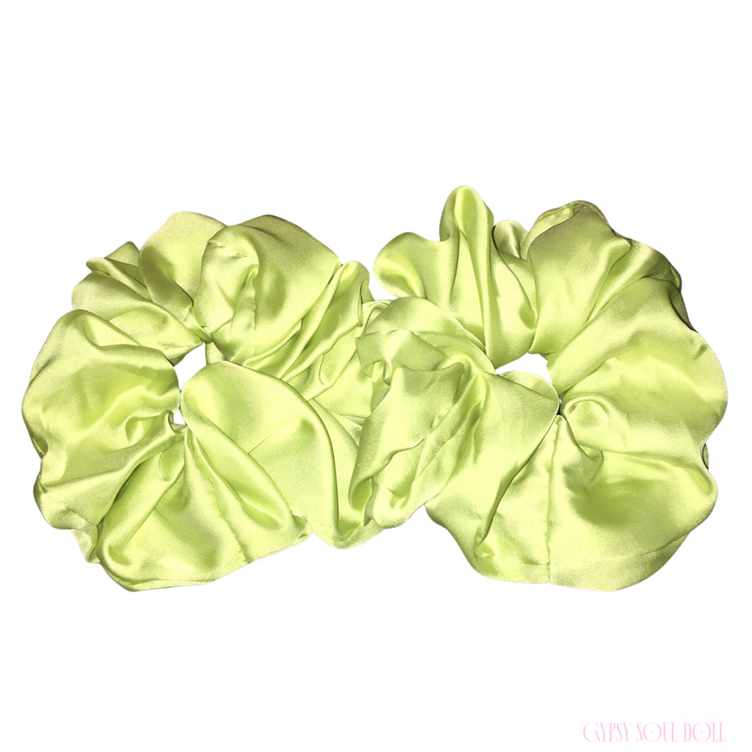 Two lime green satin hair scrunchies displayed side-by-side on a plain white background.