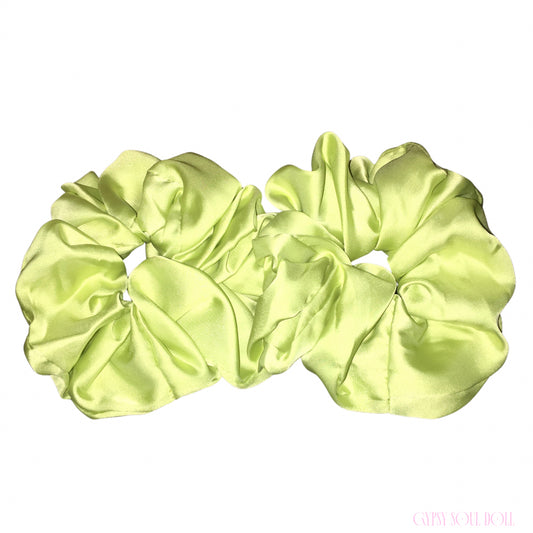 Two lime green satin hair scrunchies displayed side-by-side on a plain white background.