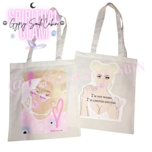 Two white canvas tote bags showing different female fashion graphic illustrations and quotes including I'm not weird I'm limited edition.