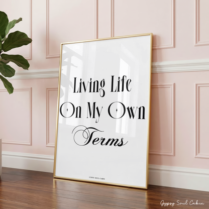 Minimalist A4 empowerment quote print featuring bold black typography text Living Life On My Own Terms centred with a cursive style script accent.