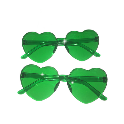 A vertical pair of Gypsy Soul Doll Lovers Lane translucent green heart-shaped sunglasses displaying a frameless Y2K design against a plain white background.