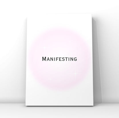 Sleek spiritual wall art print with the text Manifesting in clean typography over a soft pink airbrush aura design with sparkles.