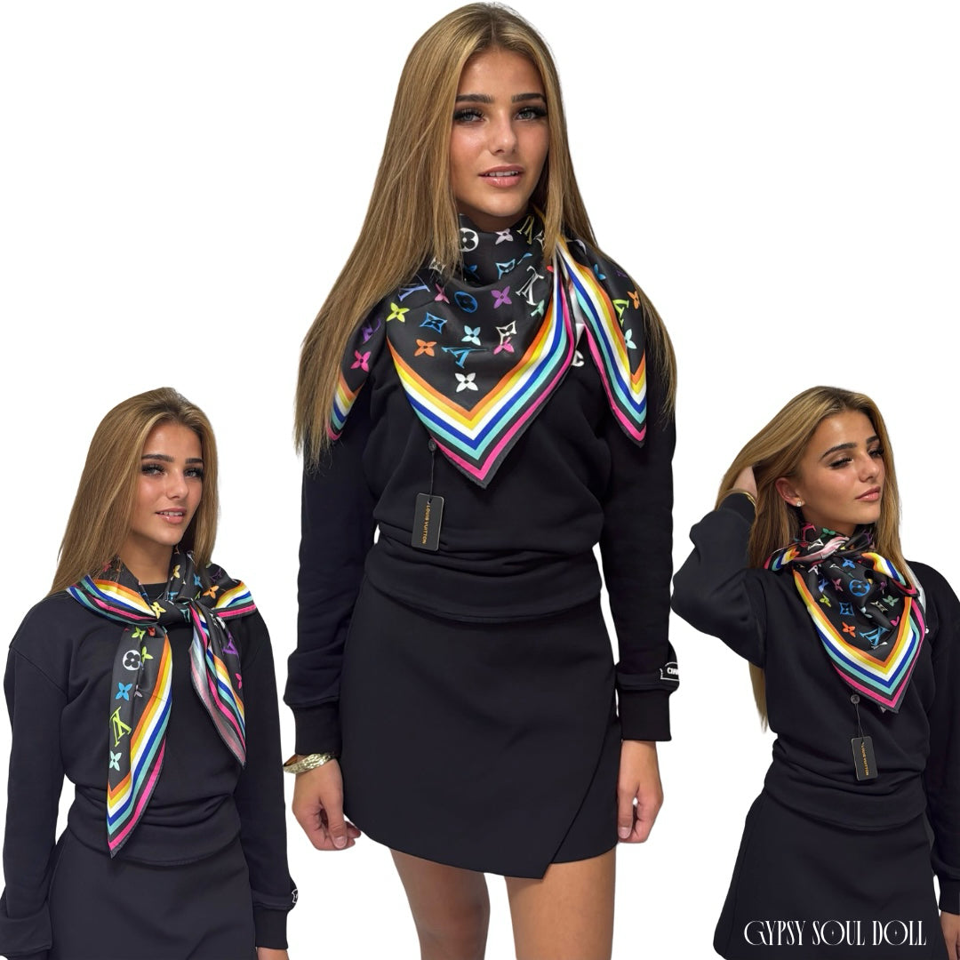 Multi-way satin classy fashion scarf featuring a colourful monogram pattern and geometric border, styled three different ways as an elegant neck wrap and shoulder accessory on a model.