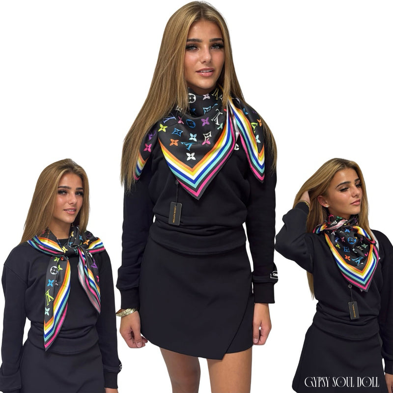 Multi-way satin classy fashion scarf featuring a colourful monogram pattern and geometric border, styled three different ways as an elegant neck wrap and shoulder accessory on a model.