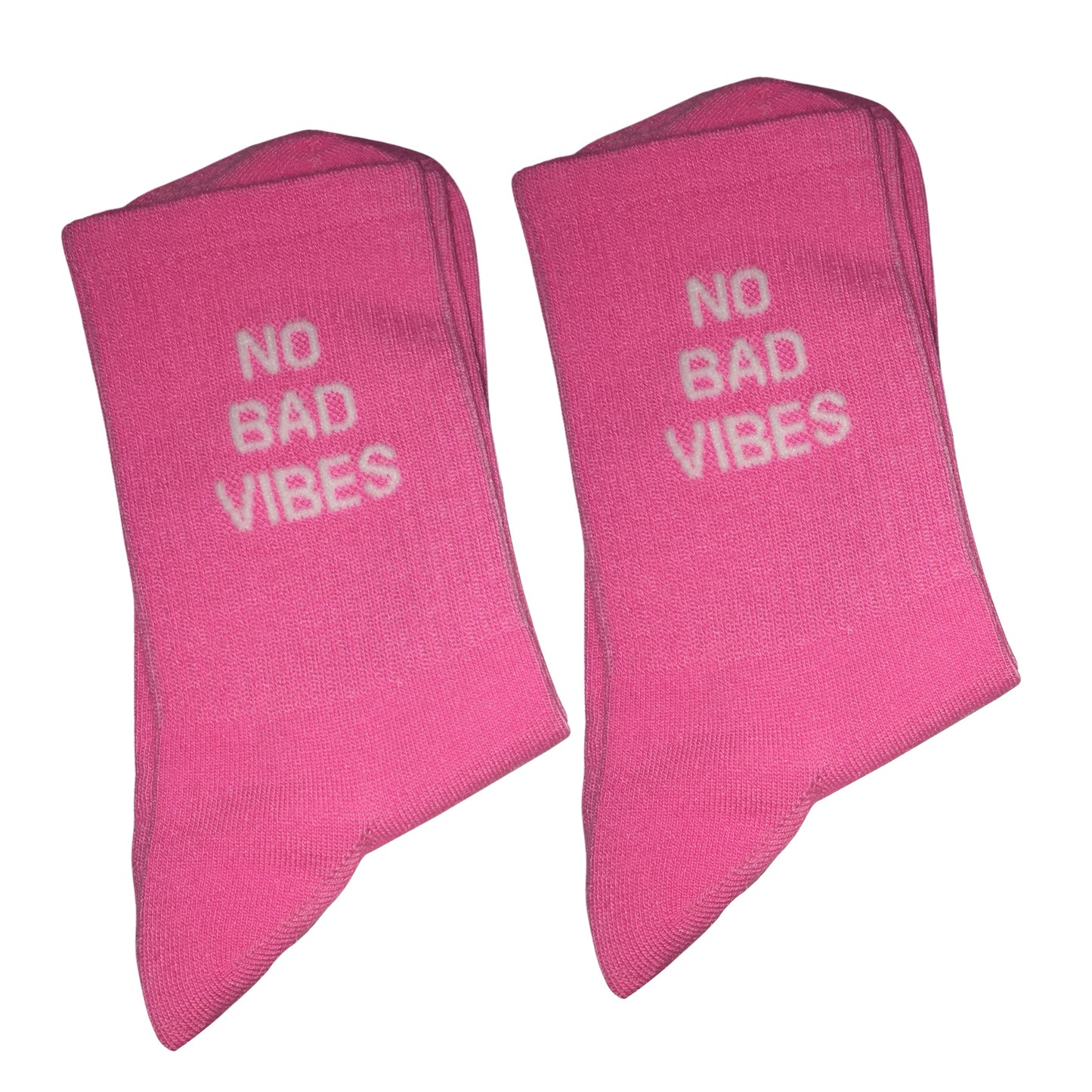 Two folded pink socks with the phrase 'NO BAD VIBES' printed in white on the front, displayed against a plain white background.
