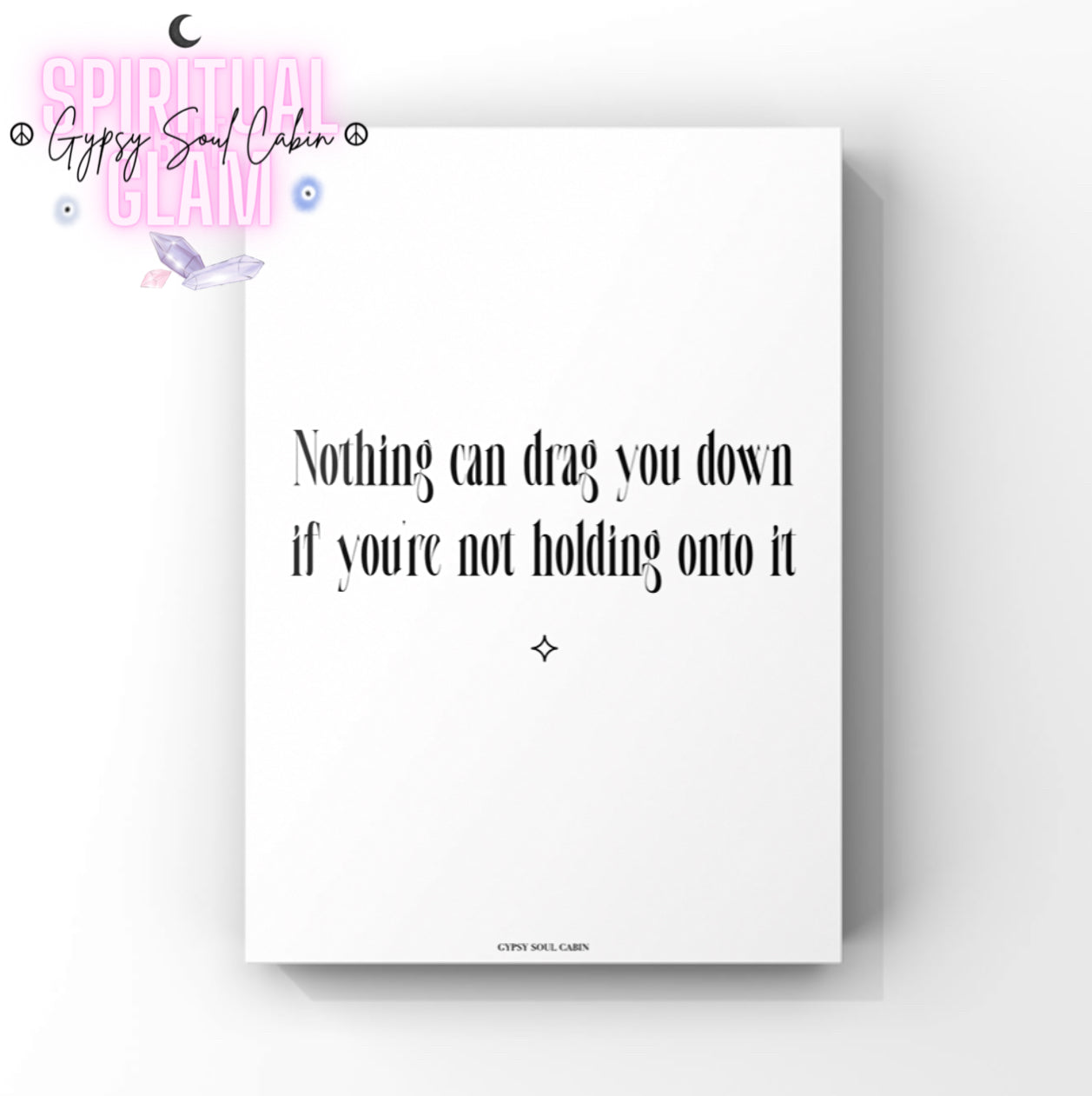 Sleek black and white motivational print displaying the empowering quote Nothing Can Drag You Down If You're Not Holding Onto It.