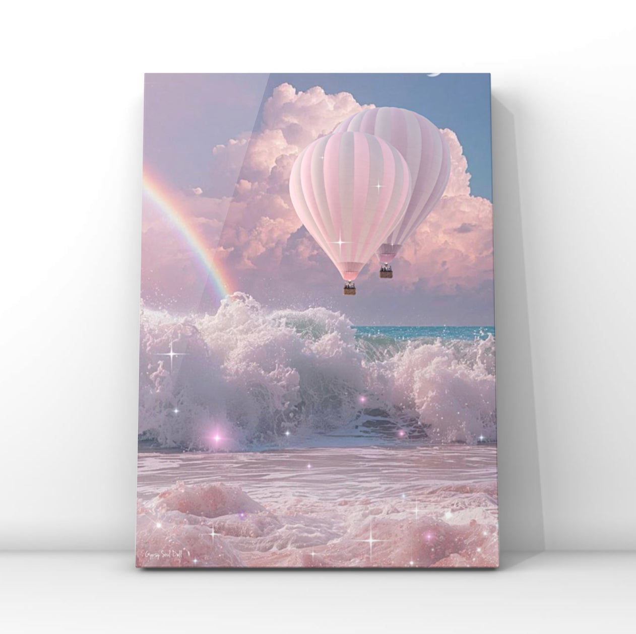 Whimsical surrealist print featuring two pink hot air balloons flying through pink fluffy clouds above crashing sea waves with a rainbow and magical star sparkles.