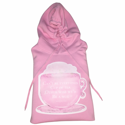 Single flat lay view of a pink cotton oversized hoodie highlighting the large cup of tea chest graphic design and long tie pull strings.