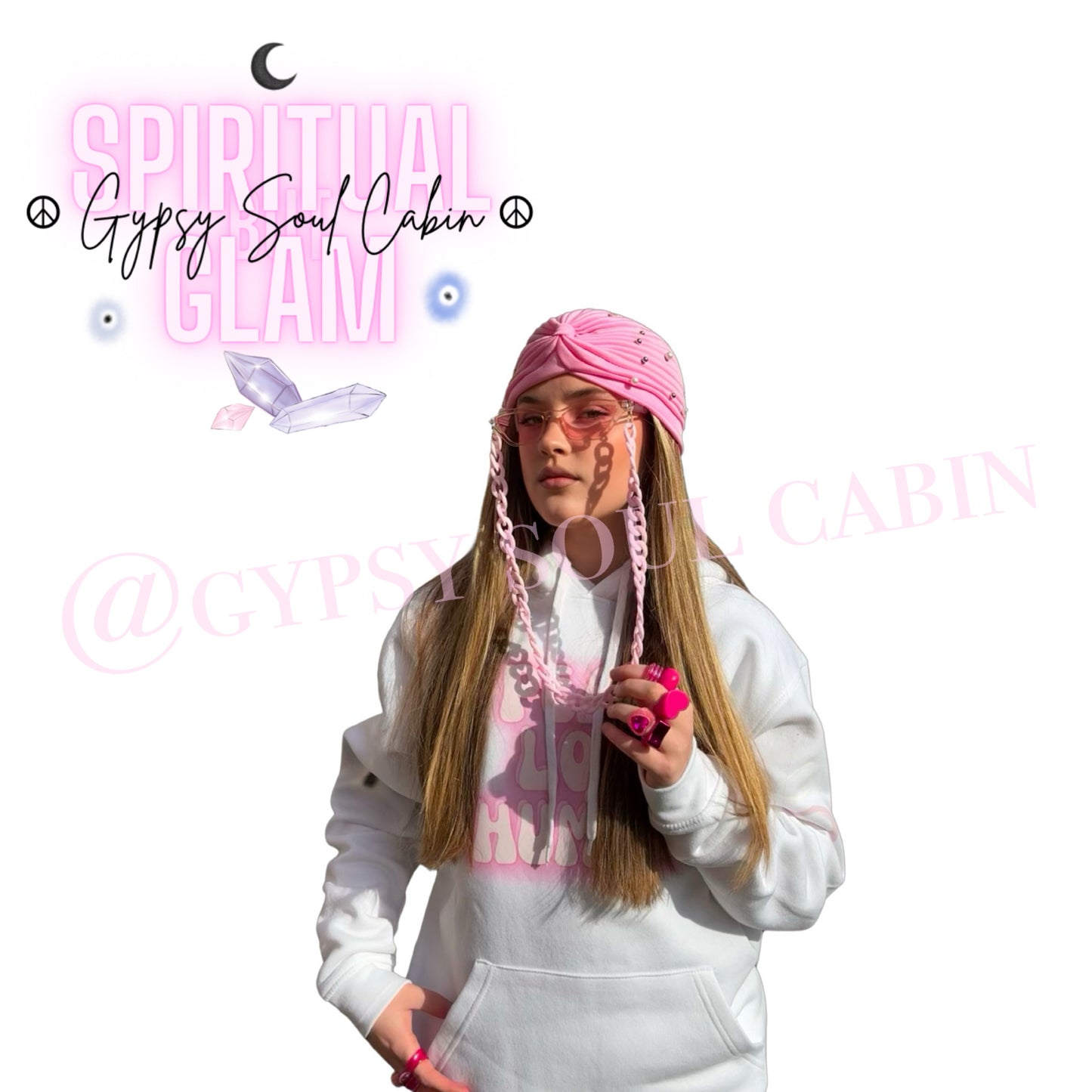 Model wearing chunky pink Y2K fashion rings paired with a matching pink pleated turban hat, heart sunglasses with a chain lanyard, and a hand-designed white peace, Love and humble hoodie by Gypsy Soul Cabin.
