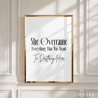 Elegant black and white typography wall art print stating She Overcame Everything That Was Meant To Destroy Her in a stylised, clean font layout.