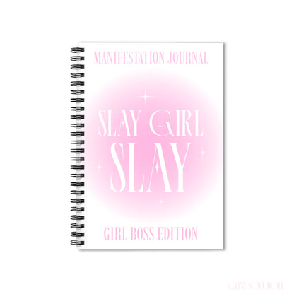 A front cover mockup of a Gypsy Soul Doll manifestation journal featuring a soft pink aura gradient centre with white sparkle stars and tall editorial typography reading Manifestation Journal Slay Girl Slay Girl Boss Edition centred over a white backdrop.