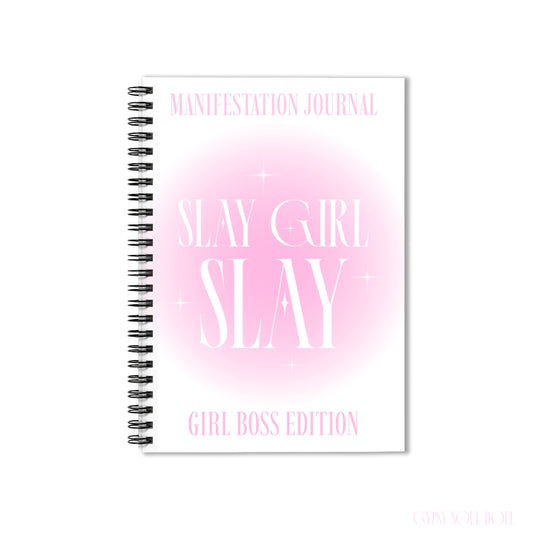 A front cover mockup of a Gypsy Soul Doll manifestation journal featuring a soft pink aura gradient centre with white sparkle stars and tall editorial typography reading Manifestation Journal Slay Girl Slay Girl Boss Edition centred over a white backdrop.