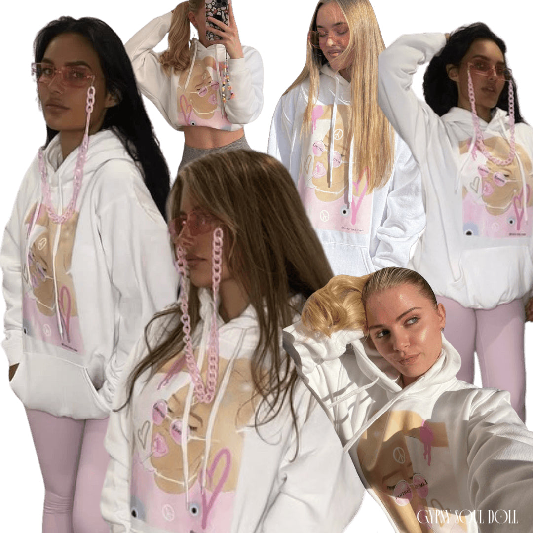 A collage of models wearing a white oversized hoodie with a front pocket and tie pull strings, featuring pink and purple spiritual-themed graphics and text on the front that reads limited edition.