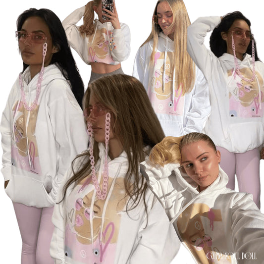 A collage of models wearing a white oversized hoodie with a front pocket and tie pull strings, featuring pink and purple spiritual-themed graphics and text on the front that reads limited edition.