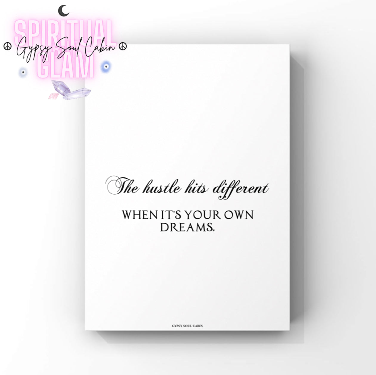 Minimalist white A4 girl boss typography print displaying the bold motivational statement text “The Hustle Hits Different When It's Your Own Dreams” centred on the page with a tiny crown icon at the end.