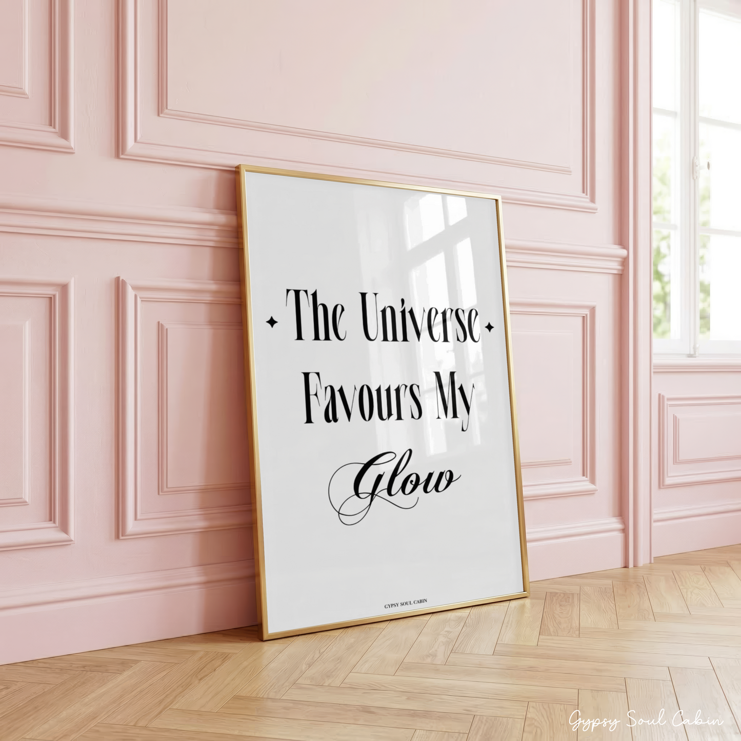 Independent girl-boss typography quote poster displaying the text "The Universe Favours My Glow" with small sparkle star icons and cursive accents.