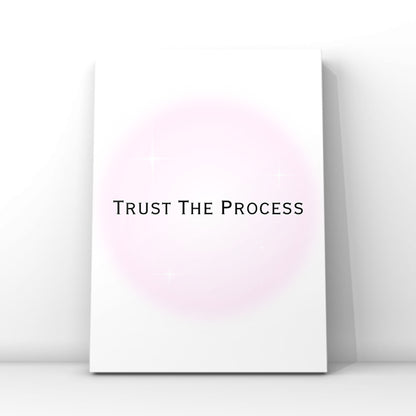Independent doll motivation quote poster displaying the text Trust The Process in a modern font over a dreamy pastel pink aura circle.