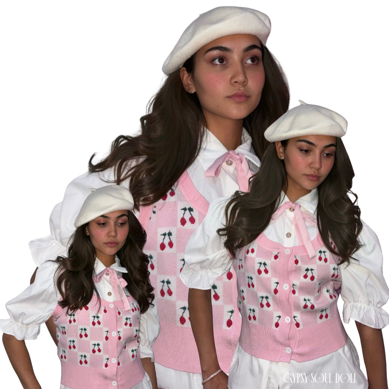 A model collage showcasing a classic ivory wool beret hat paired with a white puff sleeve blouse and a pink cherry knit vest by Gypsy Soul Doll.