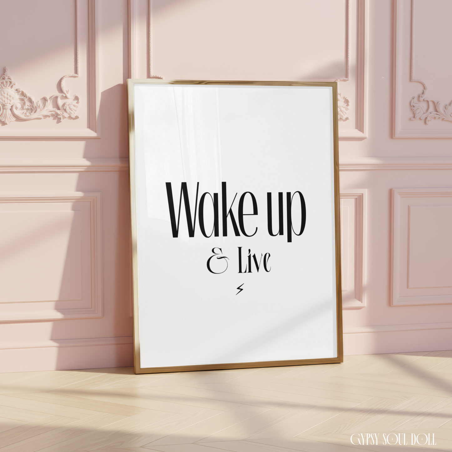 Elegant A4 motivation print displaying the phrase Wake up & Live in sharp black lettering with a tiny centred lightning bolt graphic at the bottom.