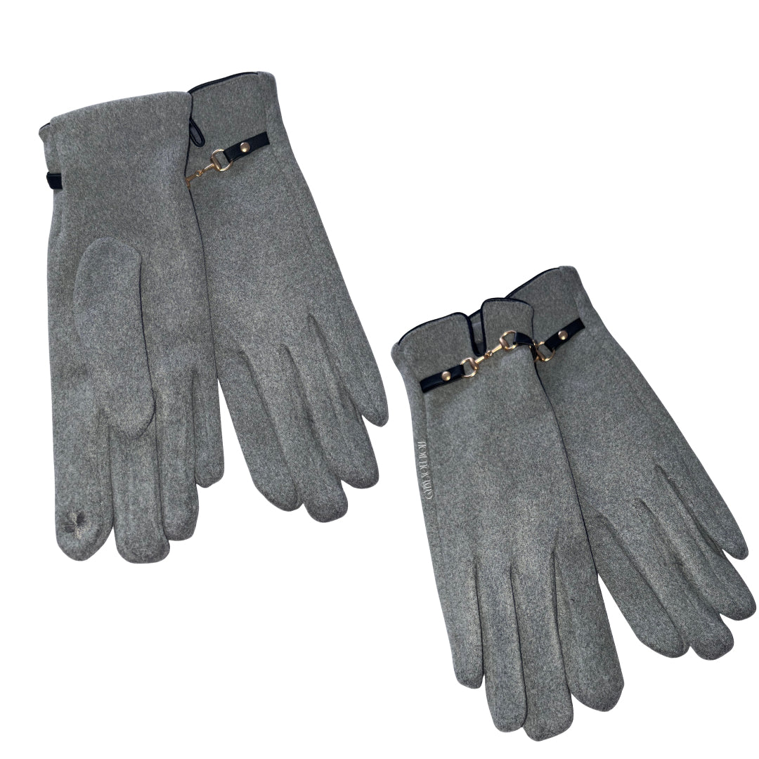 Four grey knit gloves arranged on a plain white background, with two pairs folded to show the back of the hand and one pair turned palm-side. Each glove has a black wrist strap with a small gold-tone metal detail.